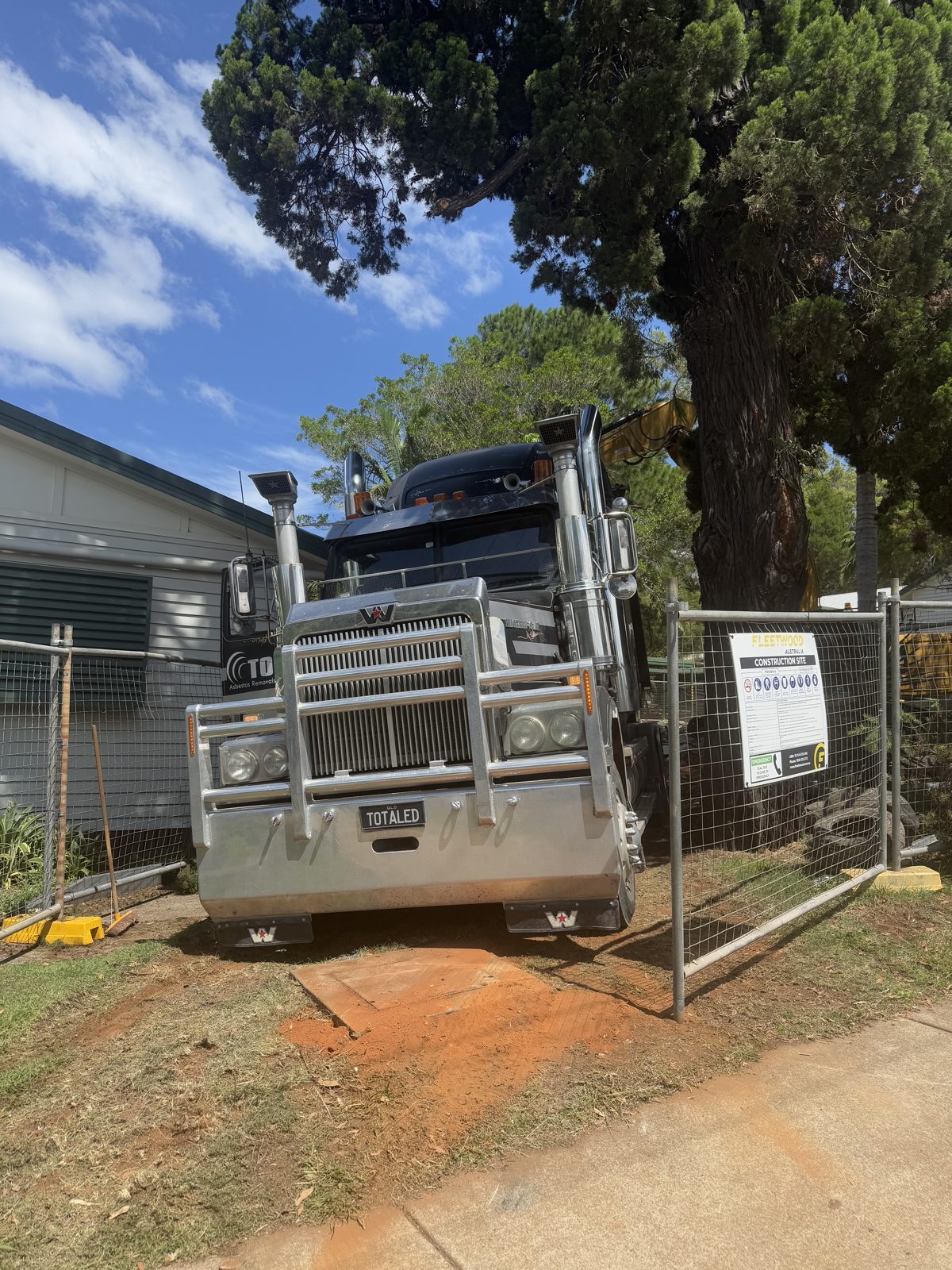 Remote Asbestos Removal at Russell Island State School 3 Total Asbestos truck at the fenced gate of Russell Island State School