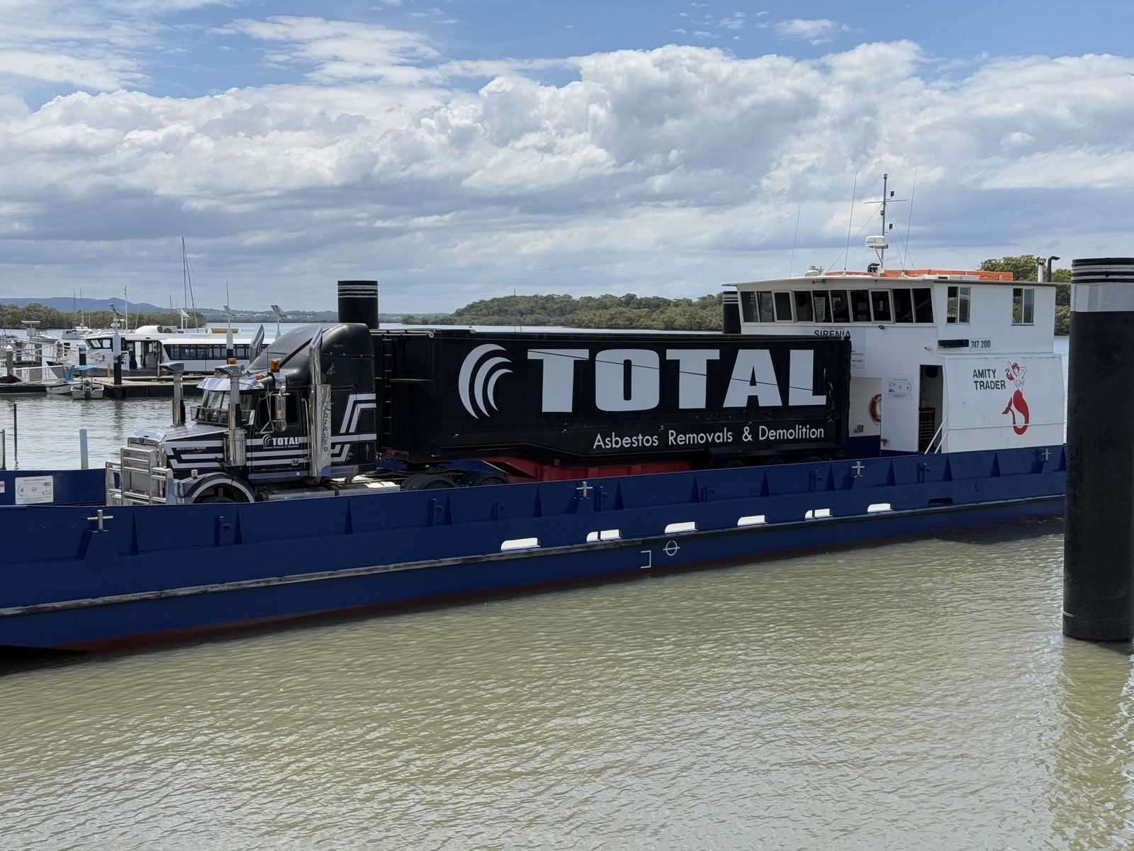 Total Asbestos truck on the barge to Russell Island for asbestos removal at the state school
